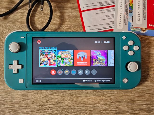 Nintendo Switch Lite Azul con varios juegos