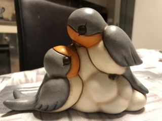 Coppia rondini Thun su nuvola