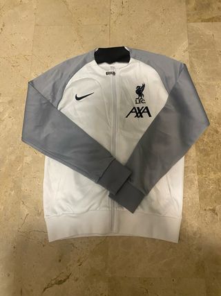 Chaqueta deportiva Nike gris y blanca