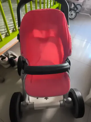 Cochecito de muñecas rosa