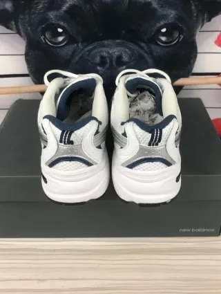Zapatillas       530      NB      blancas talla 40