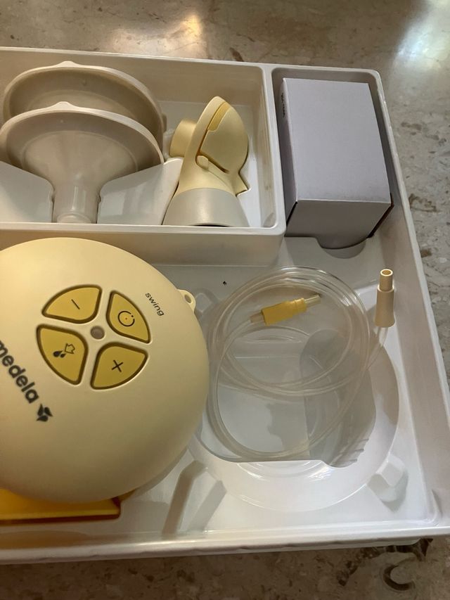 Tiralatte Medela Elettrico Swing e bottiglie
