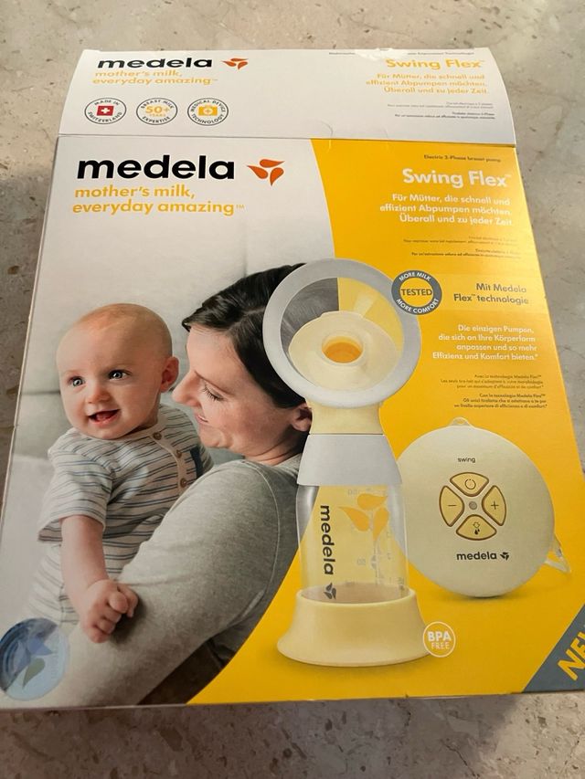 Tiralatte Medela Elettrico Swing e bottiglie