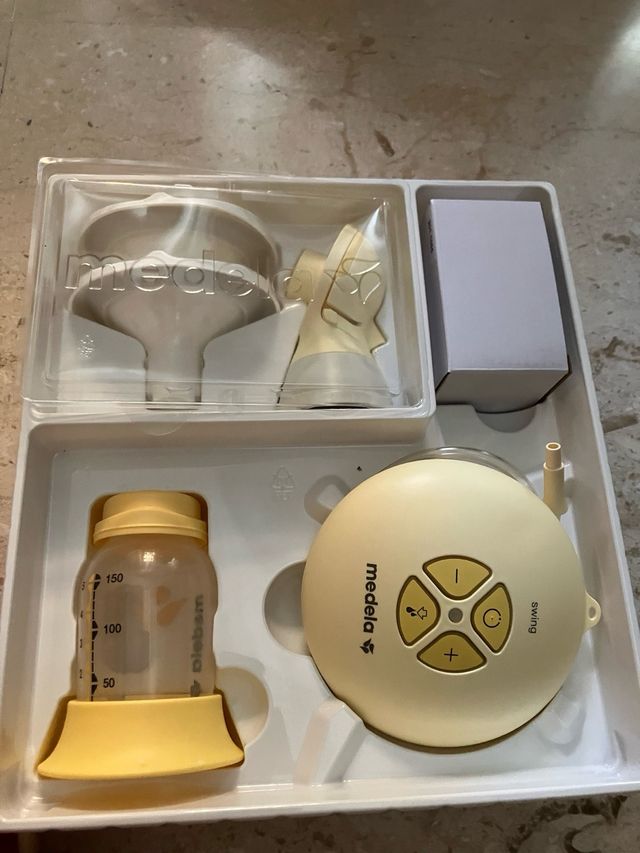 Tiralatte Medela Elettrico Swing e bottiglie