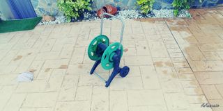 Carrito porta manguera con ruedas