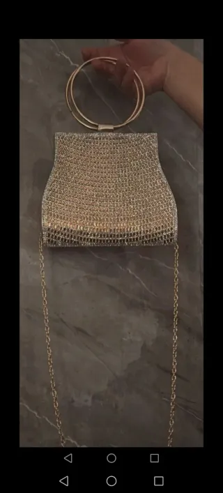 Bolso de mano de lujo dorado