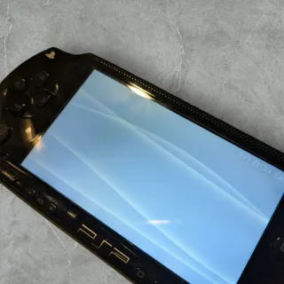 Sony PSP Fat Nera con custodia e giochi