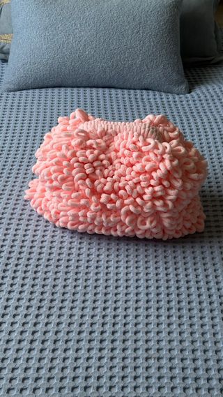 Trendy clutch made of plush pink yarn
