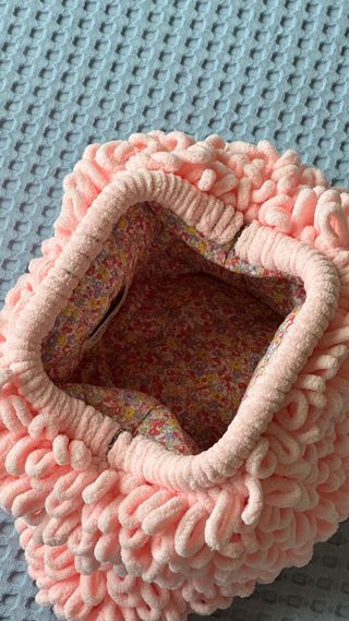 Trendy clutch made of plush pink yarn
