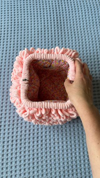 Trendy clutch made of plush pink yarn
