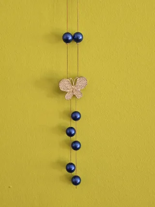 Collar mariposa y perlas azul 