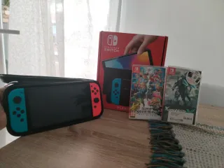 Nintendo Switch OLED azul/rojo + juegos.