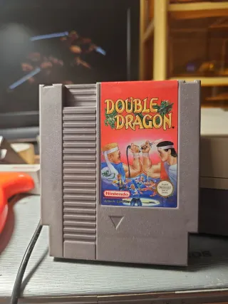Consola NES más 7 juegos, 2 mandos y pistola.