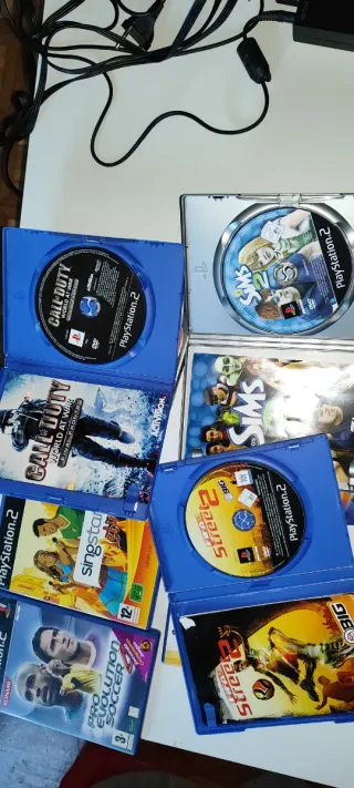 PS2 Slim Negra + 10 Juegos + Micrófonos + m. card