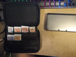 Nintendo 3DS XL + Funda Luigi + Juegos