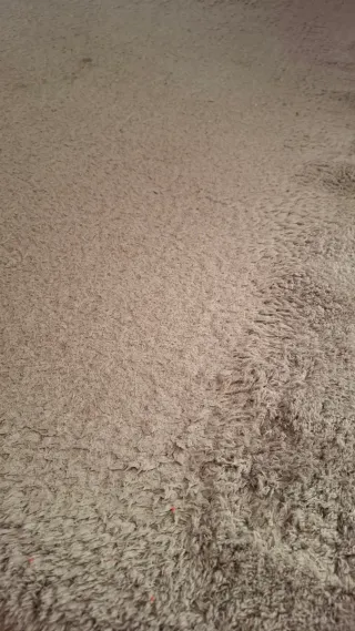 Tappeto beige in tessuto