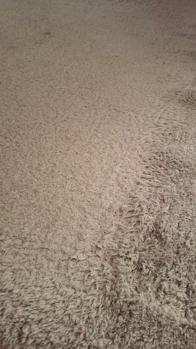 Tappeto beige in tessuto