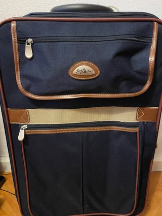 Maleta azul y marrón con detalles marrones