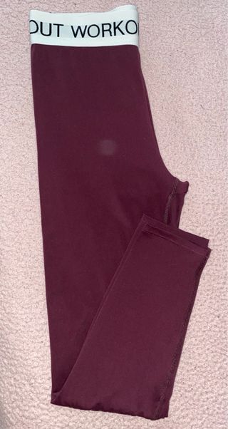 Leggings morados con banda blanca