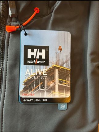 Chaqueta Helly Hansen gris y naranja. Hombre