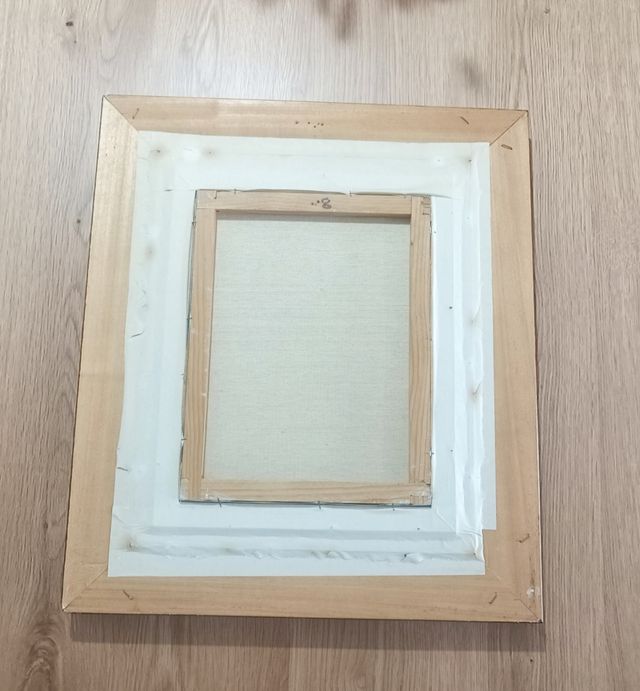 Cuadro paisaje con casas y río