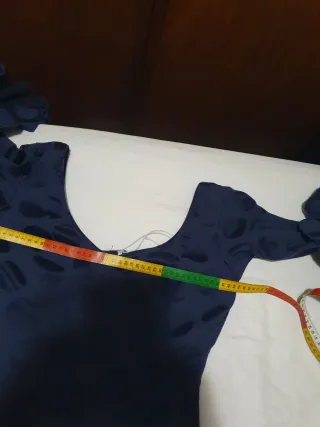 Medidas(pecho43,cintura38,cadera46,largo140)