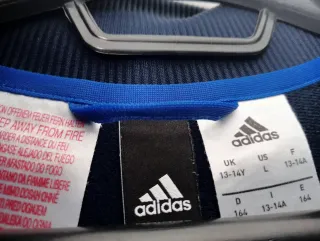 8€Chaqueta ADIDAS azul  talla 13-14 años 
