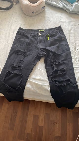 Jeans neri strappati uomo/donna