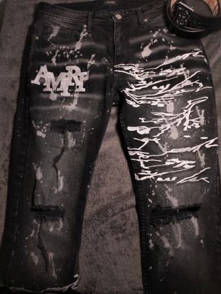 Jeans Amiri neri con schizzi bianchi
