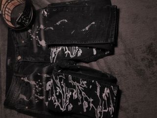 Jeans Amiri neri con schizzi bianchi