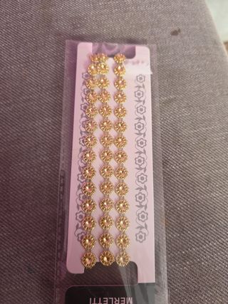 Merletto dorato con strass