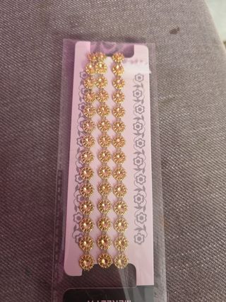 Merletto dorato con strass