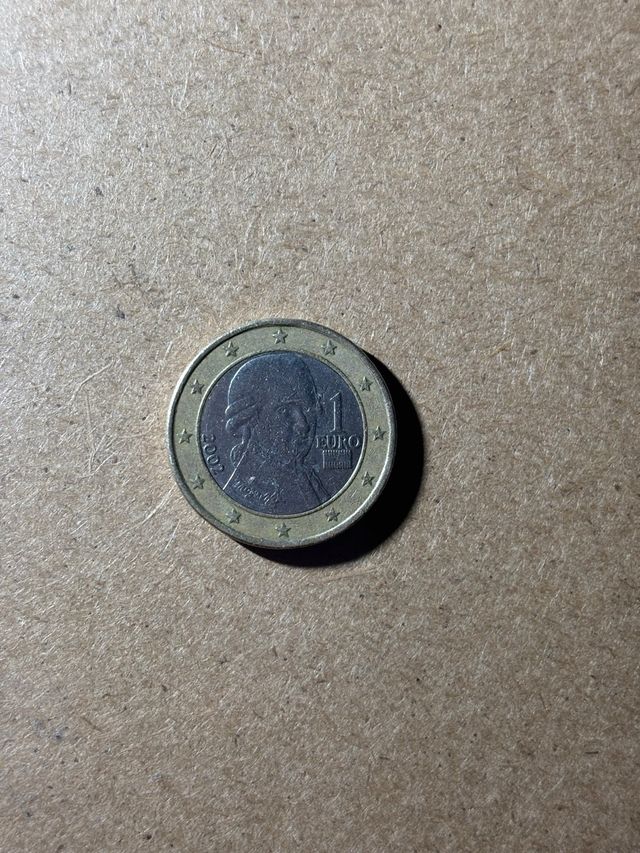 Moneda 1€ Austria Mozart 2002 error acuñación