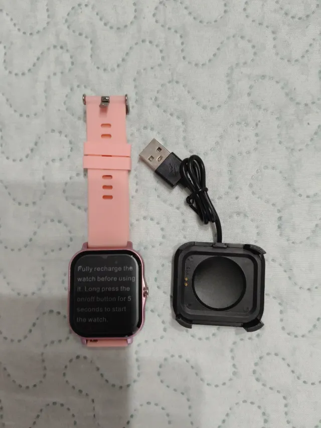 Smartwatch rosa con cargador