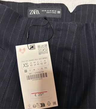 Pantalón azul marino con rayas blancas