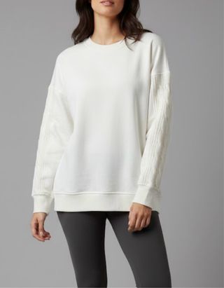 Felpa panna con maniche a treccia