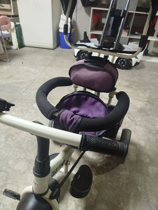 Triciclo morado para niña