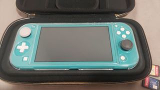 Nintendo Switch Lite Azul Turquesa y 2 juegos 
