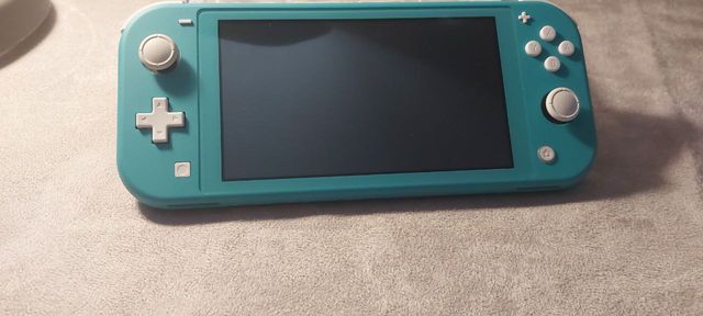 Nintendo Switch Lite Azul Turquesa y cargador
