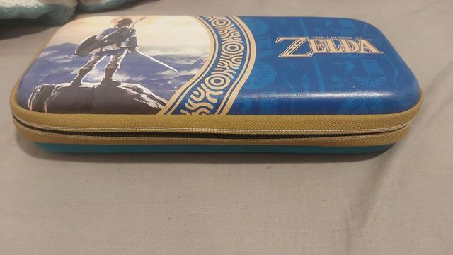 Nintendo Switch Lite Azul Turquesa y cargador