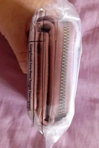 Monedero rosa piel sintética con flecos