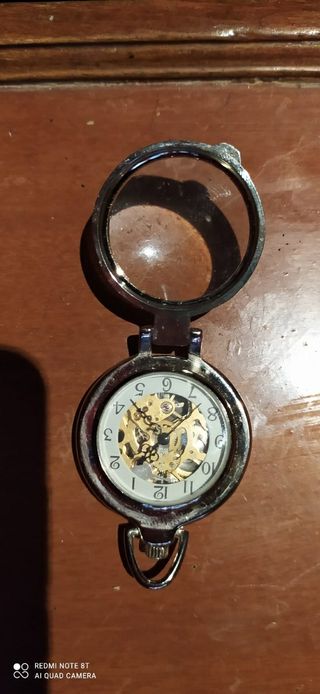 Reloj de bolsillo con tapa y mecanismo visto