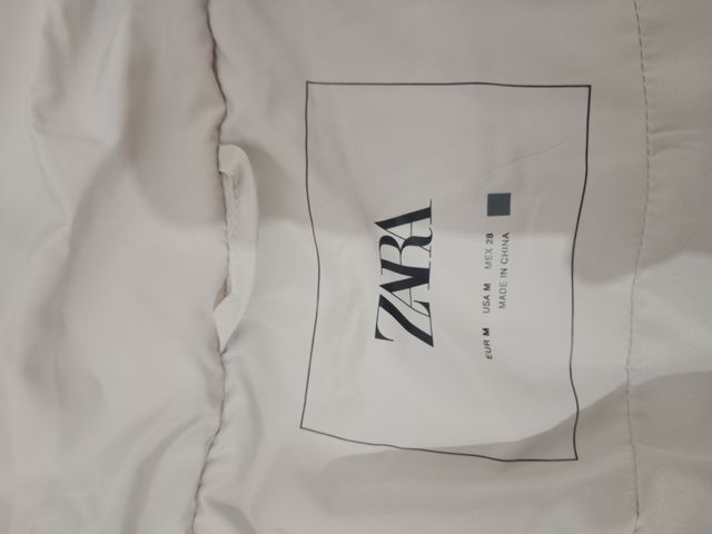 Chaleco acolchado largo beige mujer