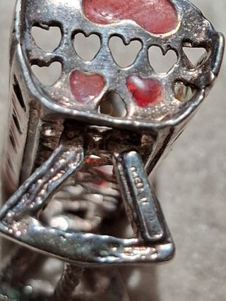 Miniatura culla argento 800 con dettagli colorati