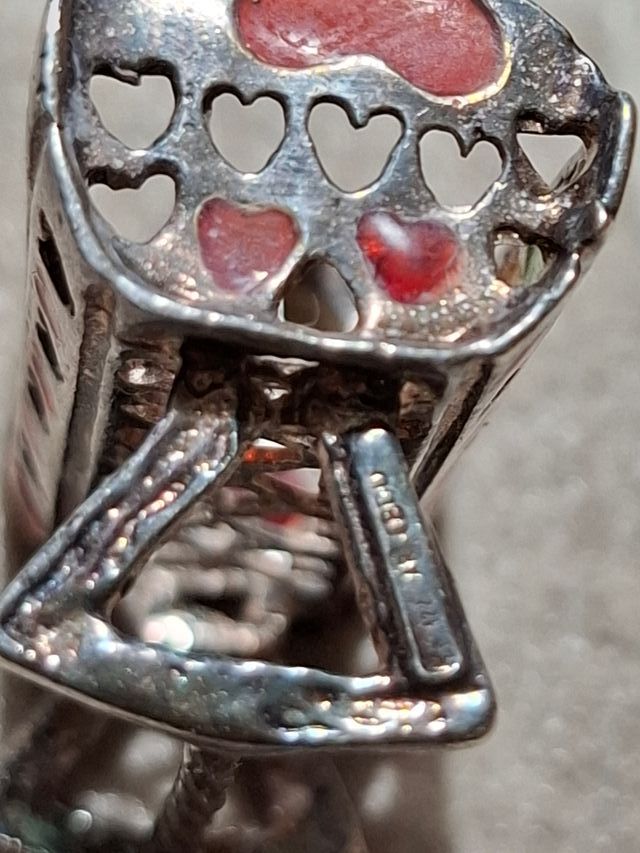 Miniatura culla argento 800 con dettagli colorati