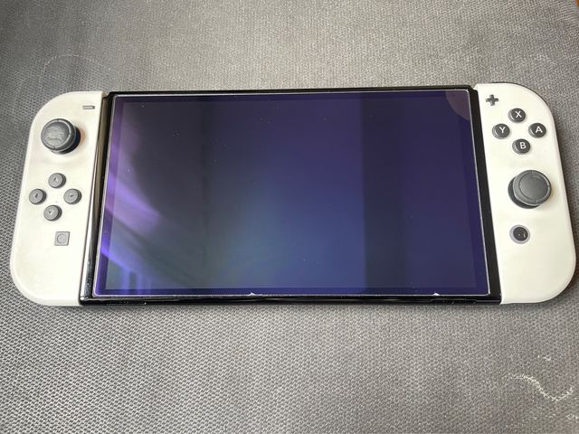 Nintendo Switch OLED + Mario Kart + Odyssey