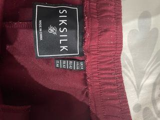 Conjunto SikSilk chándal burdeos y dorado