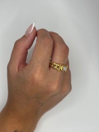 Anillo trenzado con diamante oro