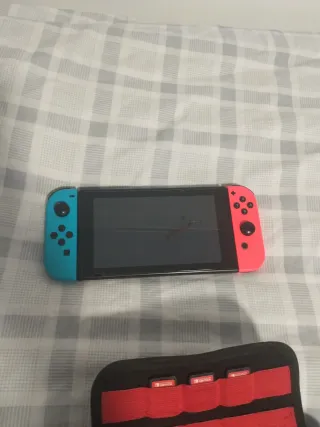 Nintendo Switch con juegos y cargador