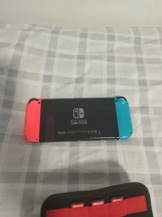 Nintendo Switch con juegos y cargador
